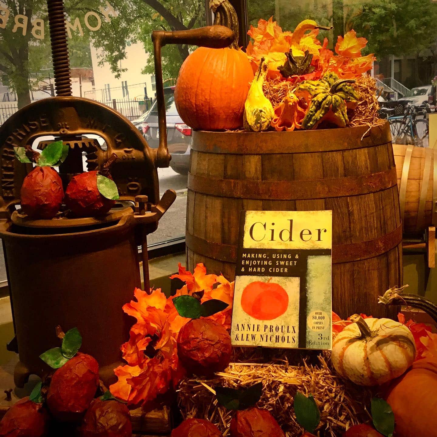 A collection of Cider Day supplies like recipe books, apples and more