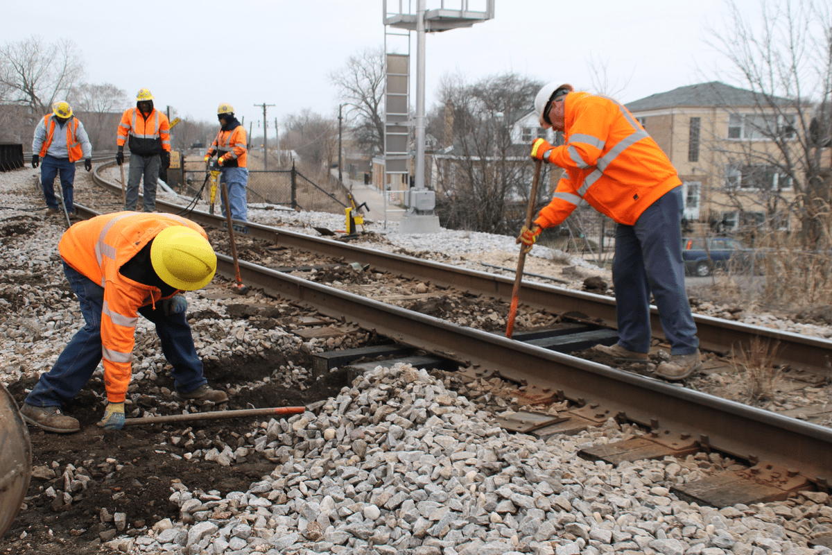 A picture of Metra construction crews working on tracks
