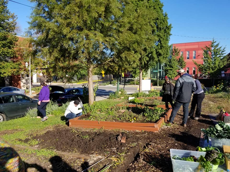 Volunteers work in the Bowmanville Gateway Garden