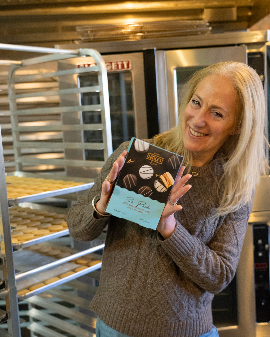 Lucila Giagrande poses with a box of her famous alfajores